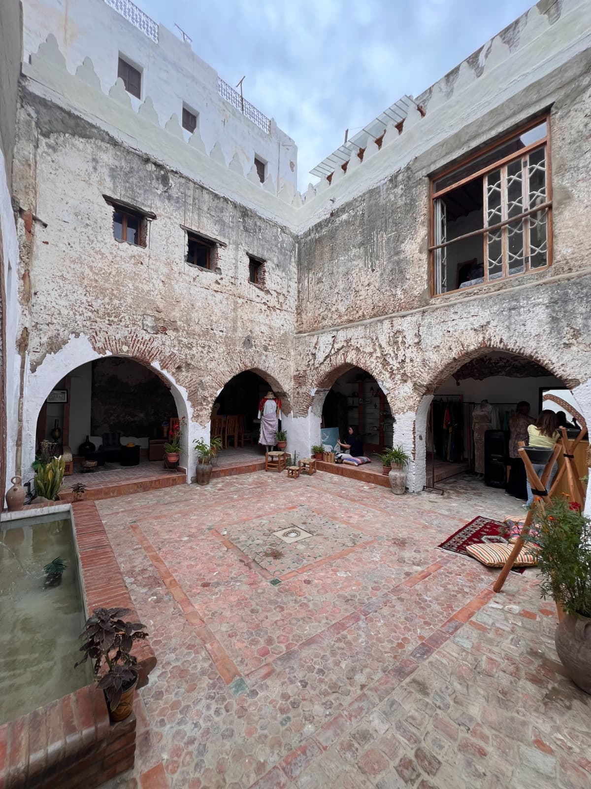 Restored Moorish arches and hand-carved plaster details inside El Patio